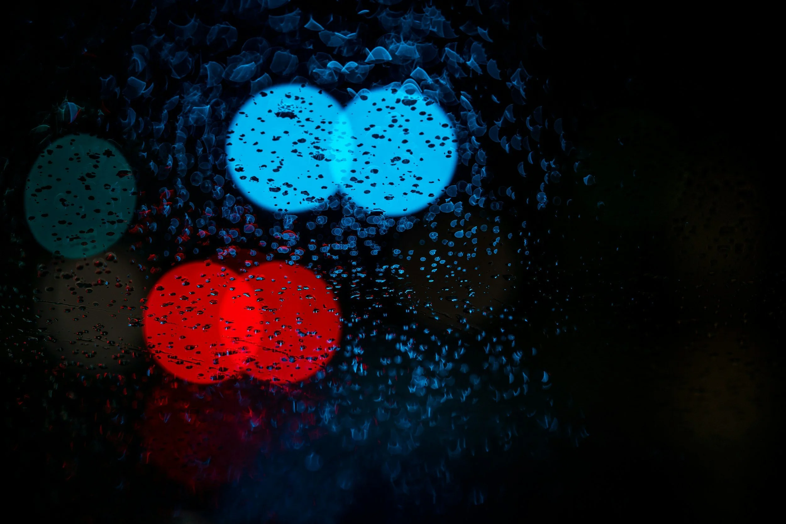 Red and blue lights illustrating What a first responder sees on the job can change the lens through which they see the world.