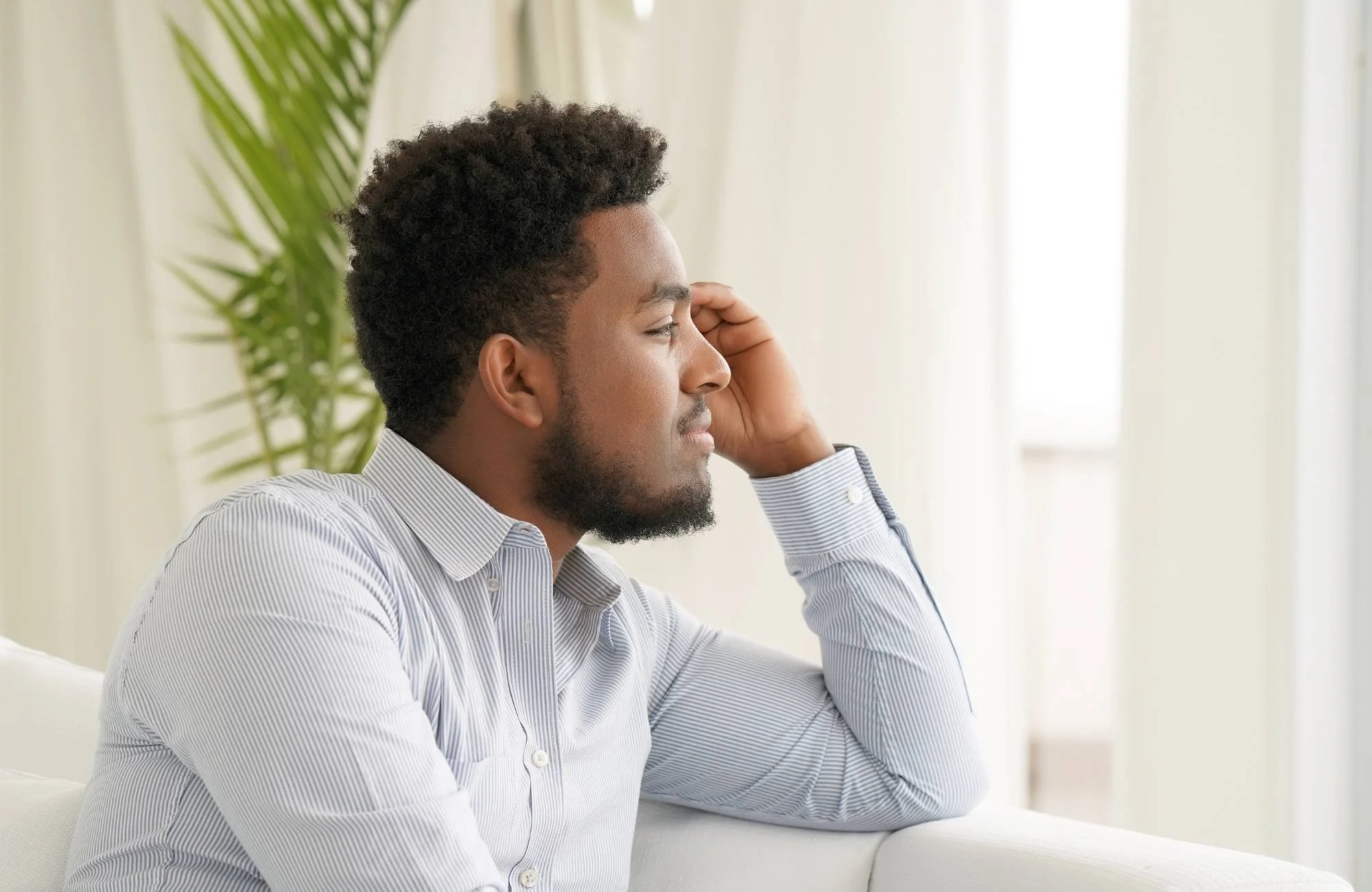 A man wondering about why he has a fear of change and whether therapy for men would help
