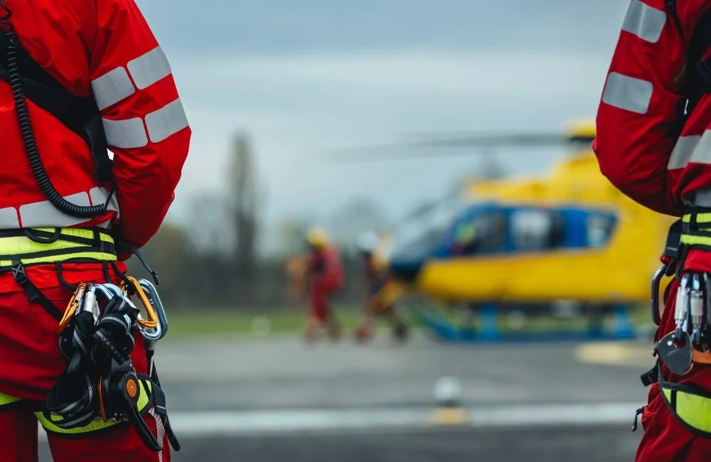 First responders in front of a helicopter