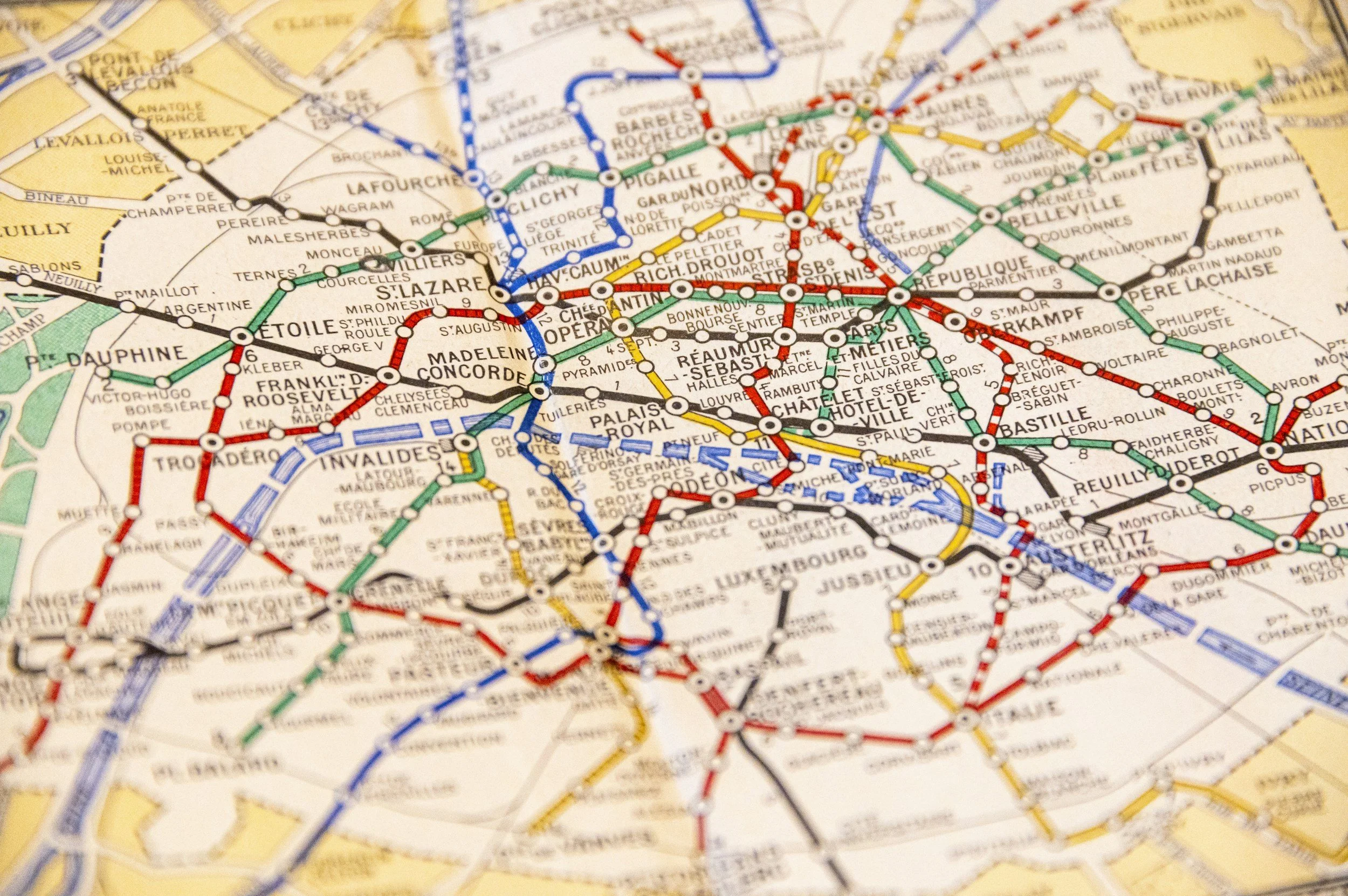 A detailed map of the Paris metro system with colored lines and station names.