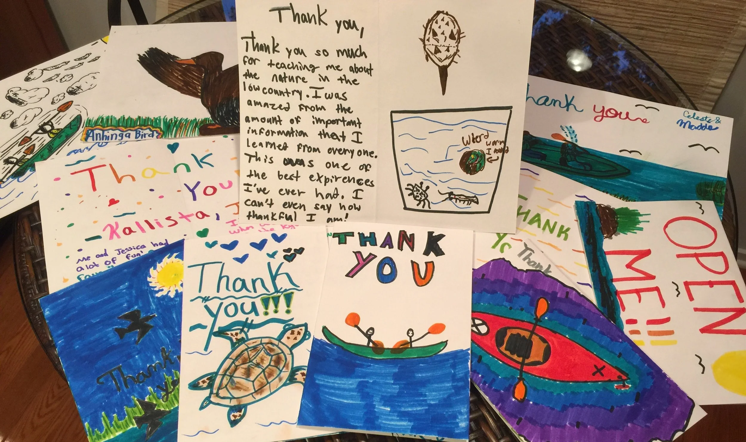 Collection of handwritten thank you cards with colorful drawings and messages.
