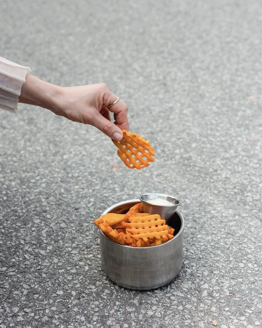 Waffle Fries are here -  golden, crunchy, and served with our house-made garlic aioli.