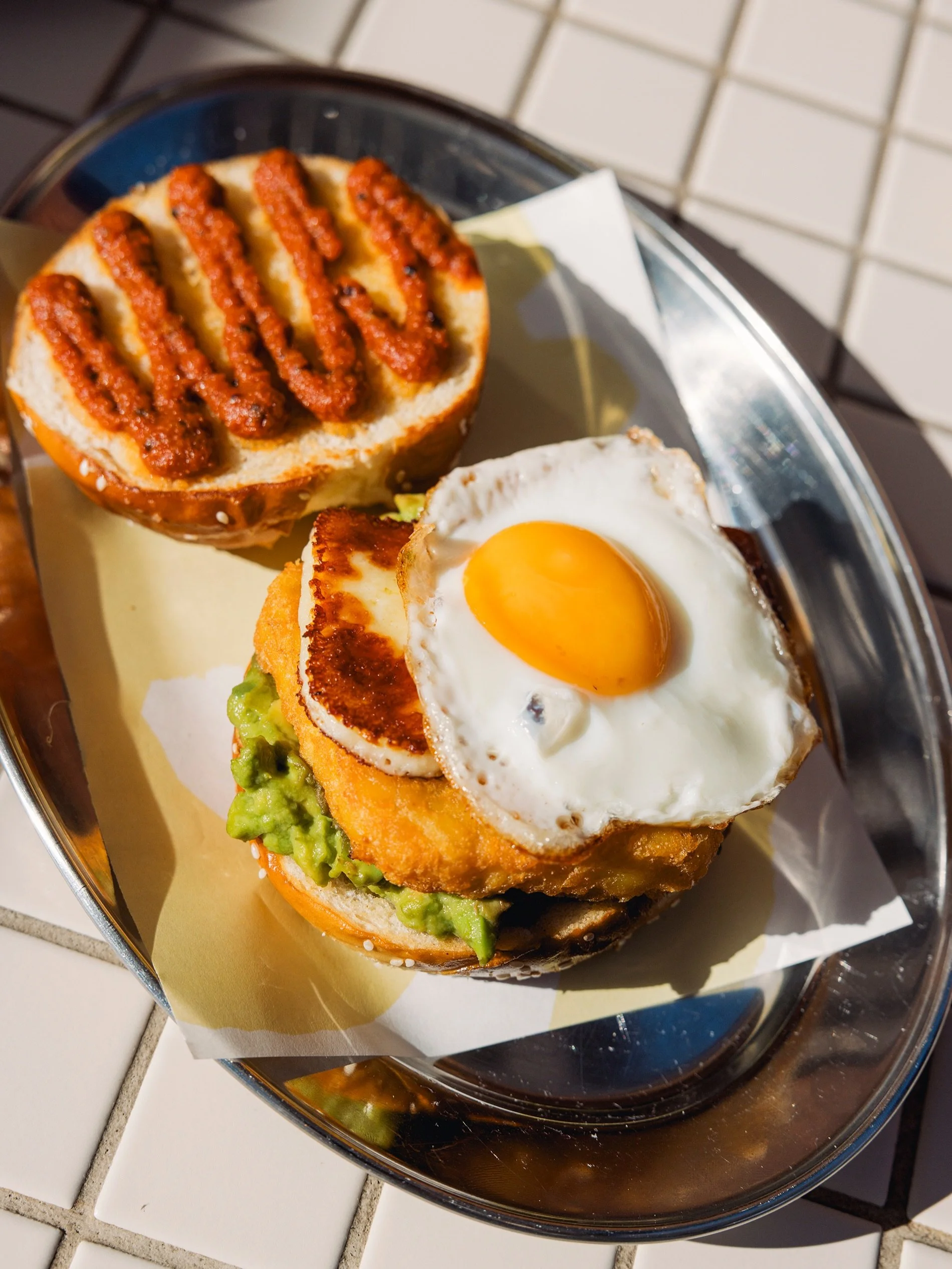 Meet your new breakfast favourite.

Halloumi, smashed avocado, a golden hash brown, fried egg, and your choice of house-made HP sauce or kasundi ketchup, all tucked into a toasted pretzel bun.

It&rsquo;s vegetarian, full of flavour, and now part of 