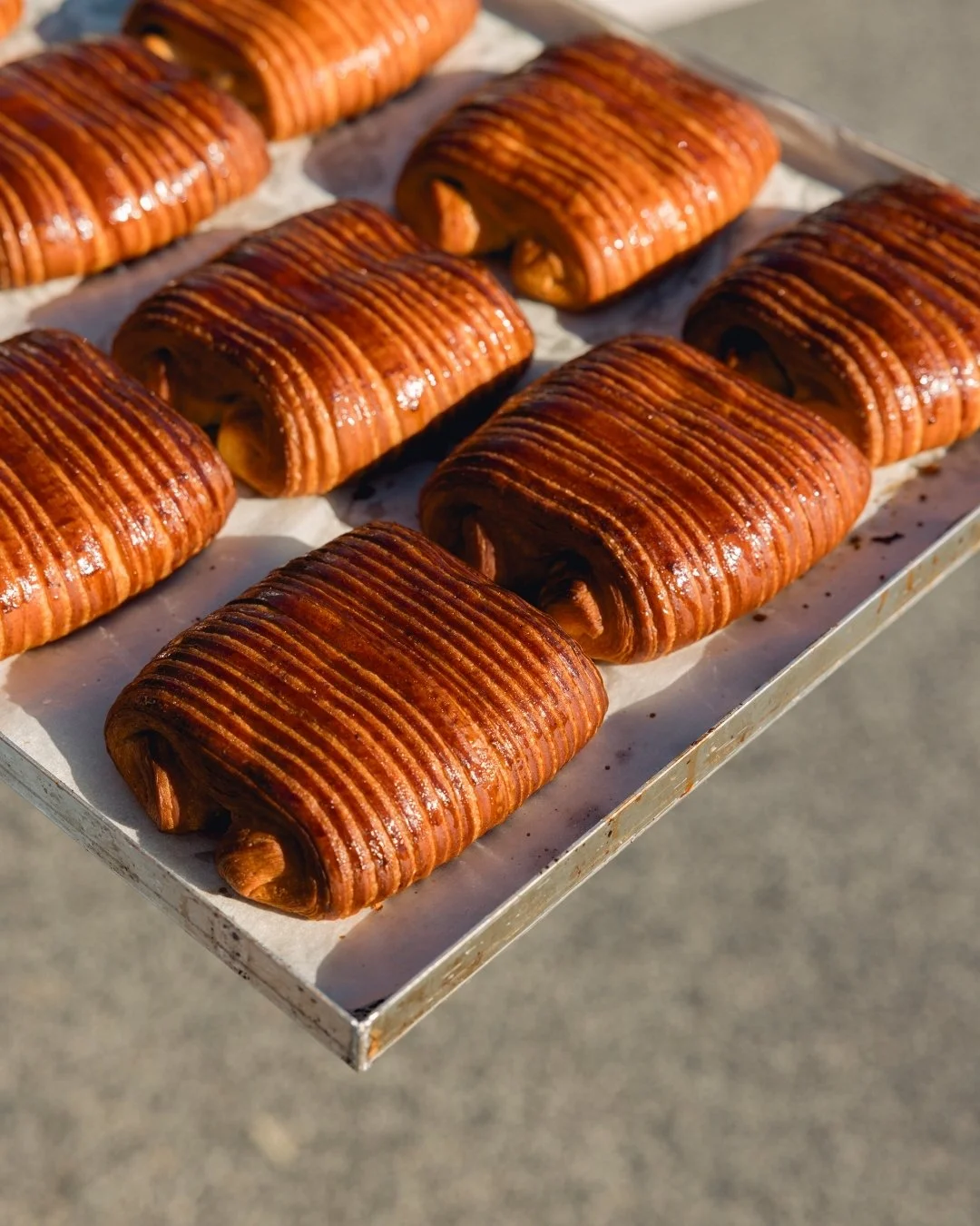 A fresh take on a classic.

Our Pain au Chocolat is now made with buckwheat, bringing a richer flavour, beautiful colour and an extra crisp, flaky finish. You&rsquo;ll also notice a new shape, but the buttery layers and dark chocolate centre remain j