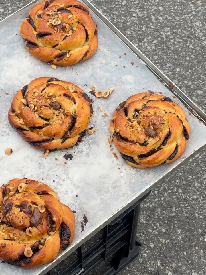 Have you tried our babka knot? Rich layers of chocolate and hazelnut, twisted into golden dough and finished with a little crunch. Pull apart, get a little messy. Very much worth it!

Available daily until sold out through September