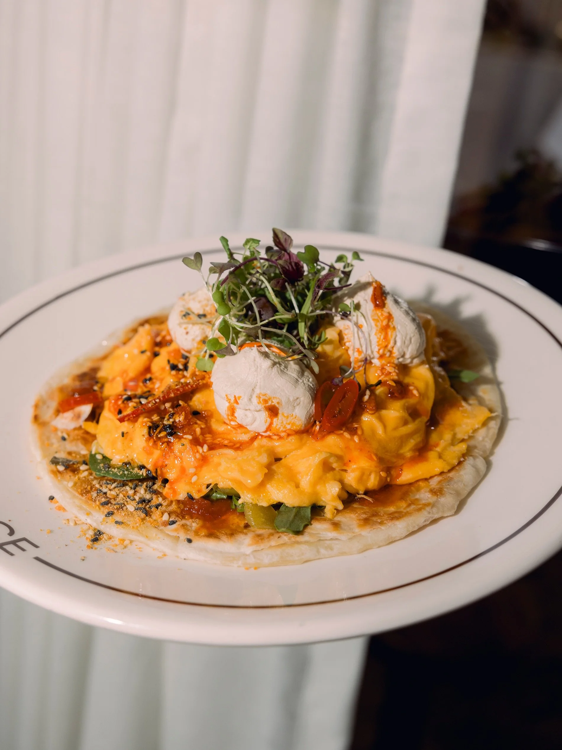 New on the breakfast menu.

Chilli Scram. Folded eggs, coffee and coriander labneh, kasundi, house made chilli crunch, herb salad, flaky paratha

Available 7am - 11am daily.