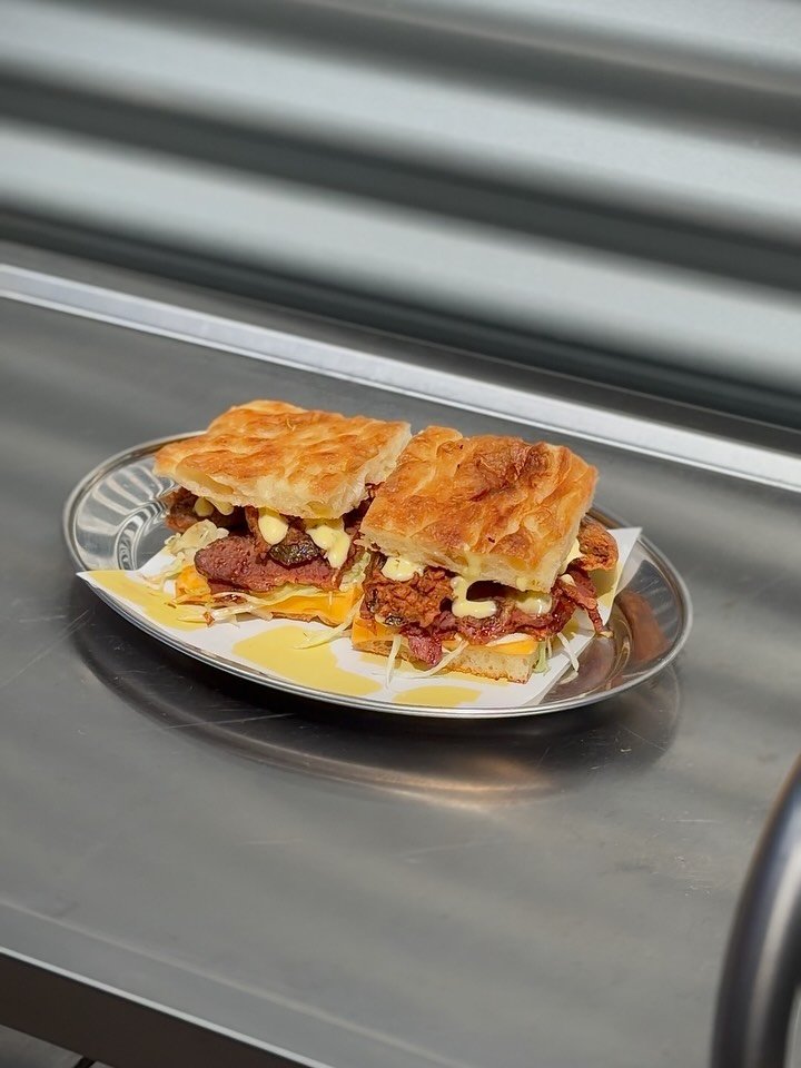 All the good bits of a cheeseburger, with a Side Piece change of address.

Sliced beef brisket, American cheese, dill pickle mustard mayo and a deep-fried pickle, packed into our focaccia. A little messy. Very much worth it.

Beef and Pickle Focaccia