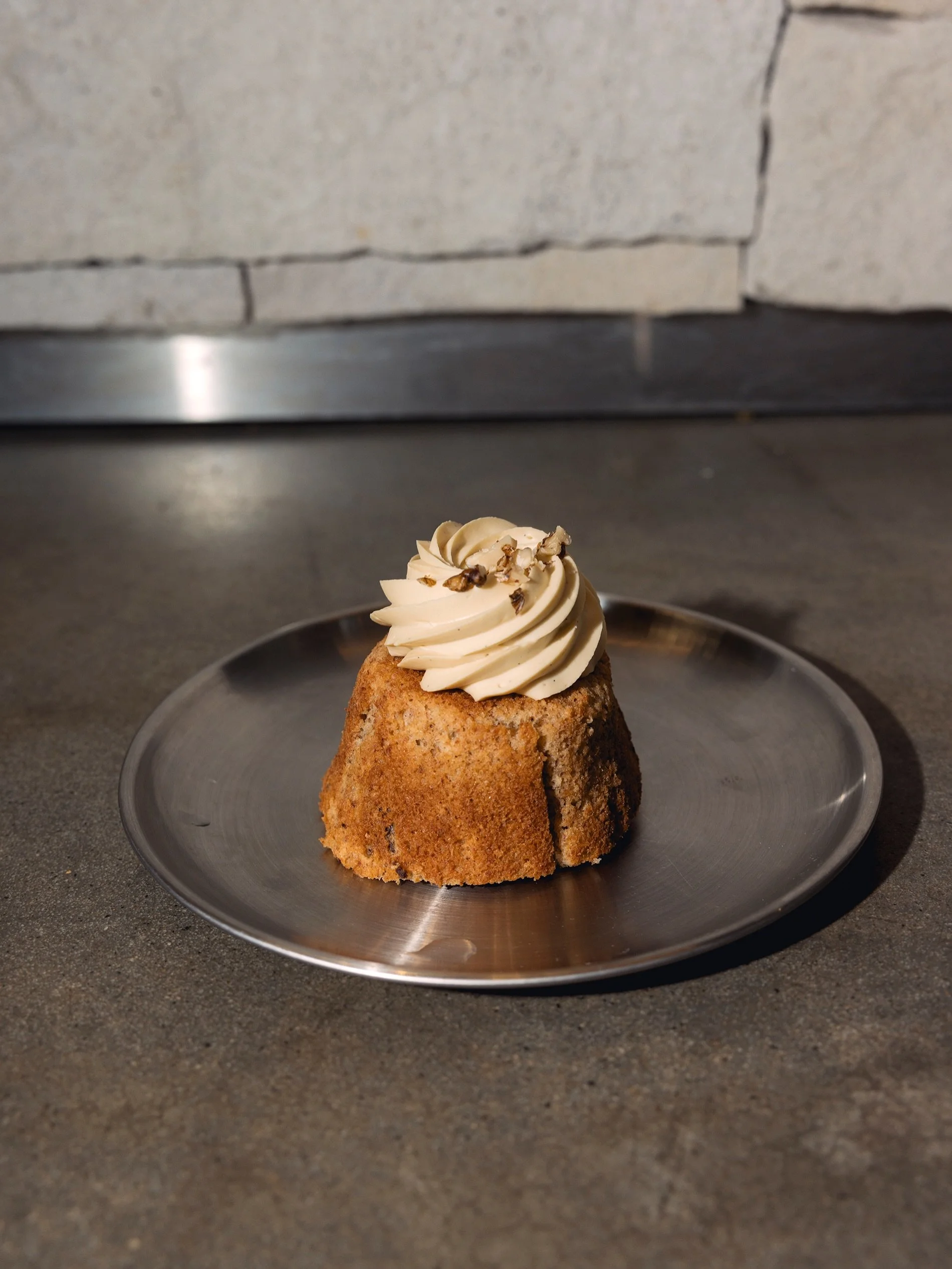 Low gluten banana cakes, dressed for the occasion with a little frosting on top. 

Available daily until sold out
