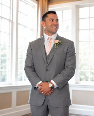 Image of Man in gray Suit- Michael Amarell The Founder of Precision Industrial Elevator