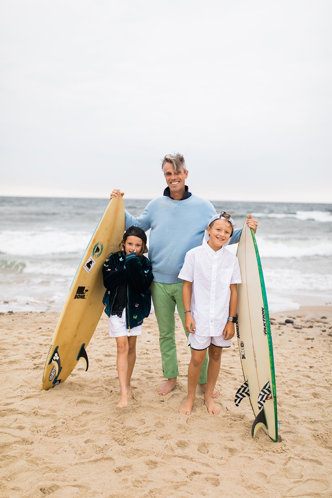 Montauk Hamptons family photographer dad with surfboards.jpg
