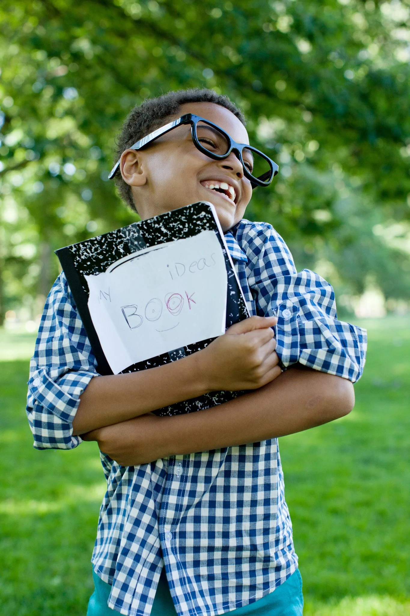 Happy NYC boy with school work