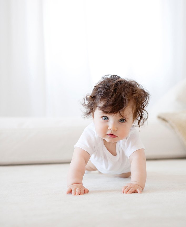NYC-advertising-photographer-babies-studio-curly-haired-baby.jpg