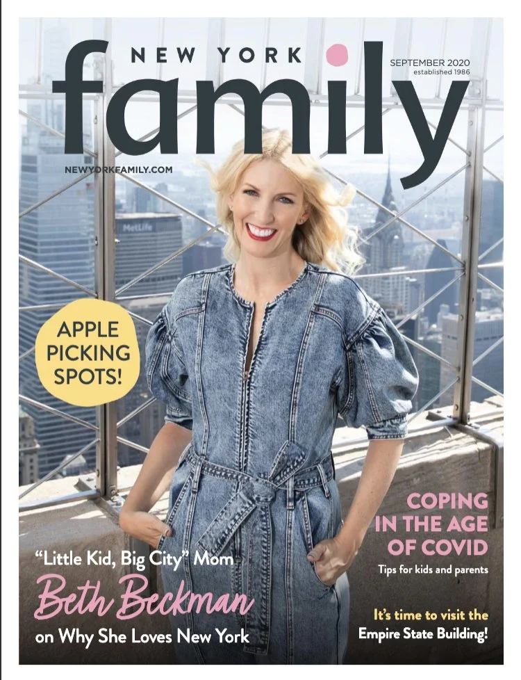 Cover of New York Family magazine featuring a woman with blonde hair in a denim jumpsuit, smiling on a rooftop with the New York City skyline in the background. Includes headlines about apple picking spots, coping during COVID, and an interview with 