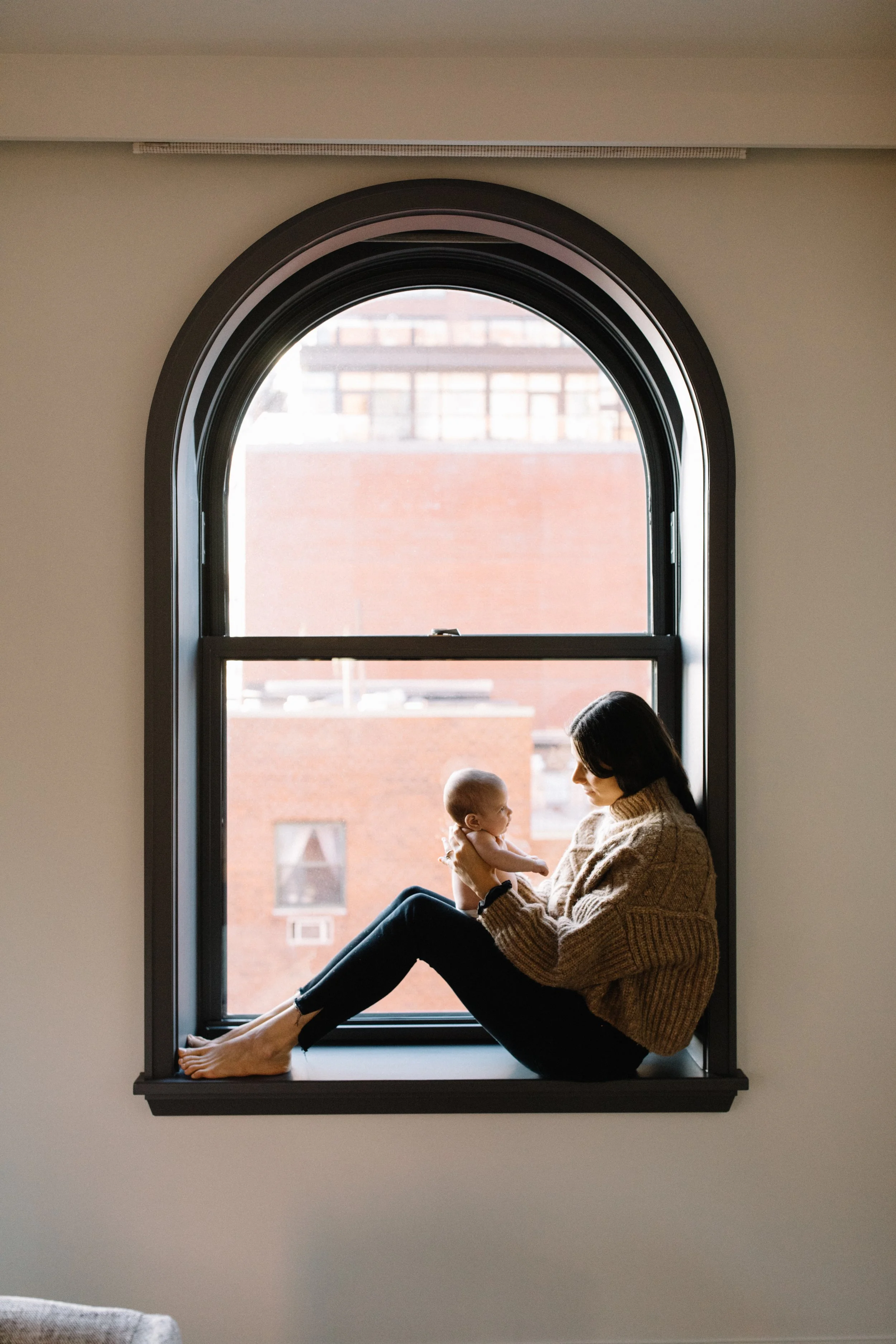 Tribeca family photo in window light with baby