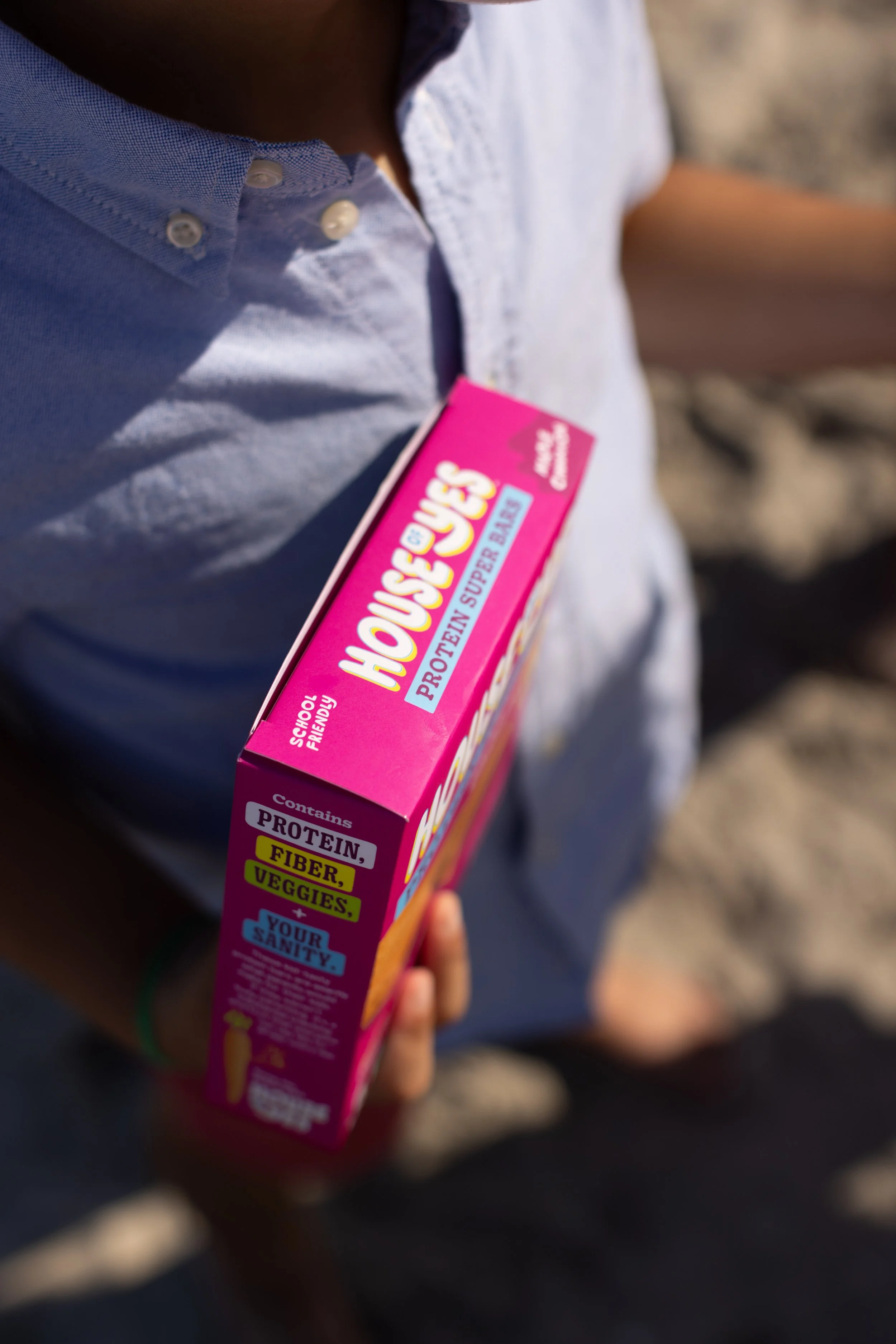NYC-lifestyle-photographer-food-protein-bar-House-of-Yes-box-in-hand.jpg