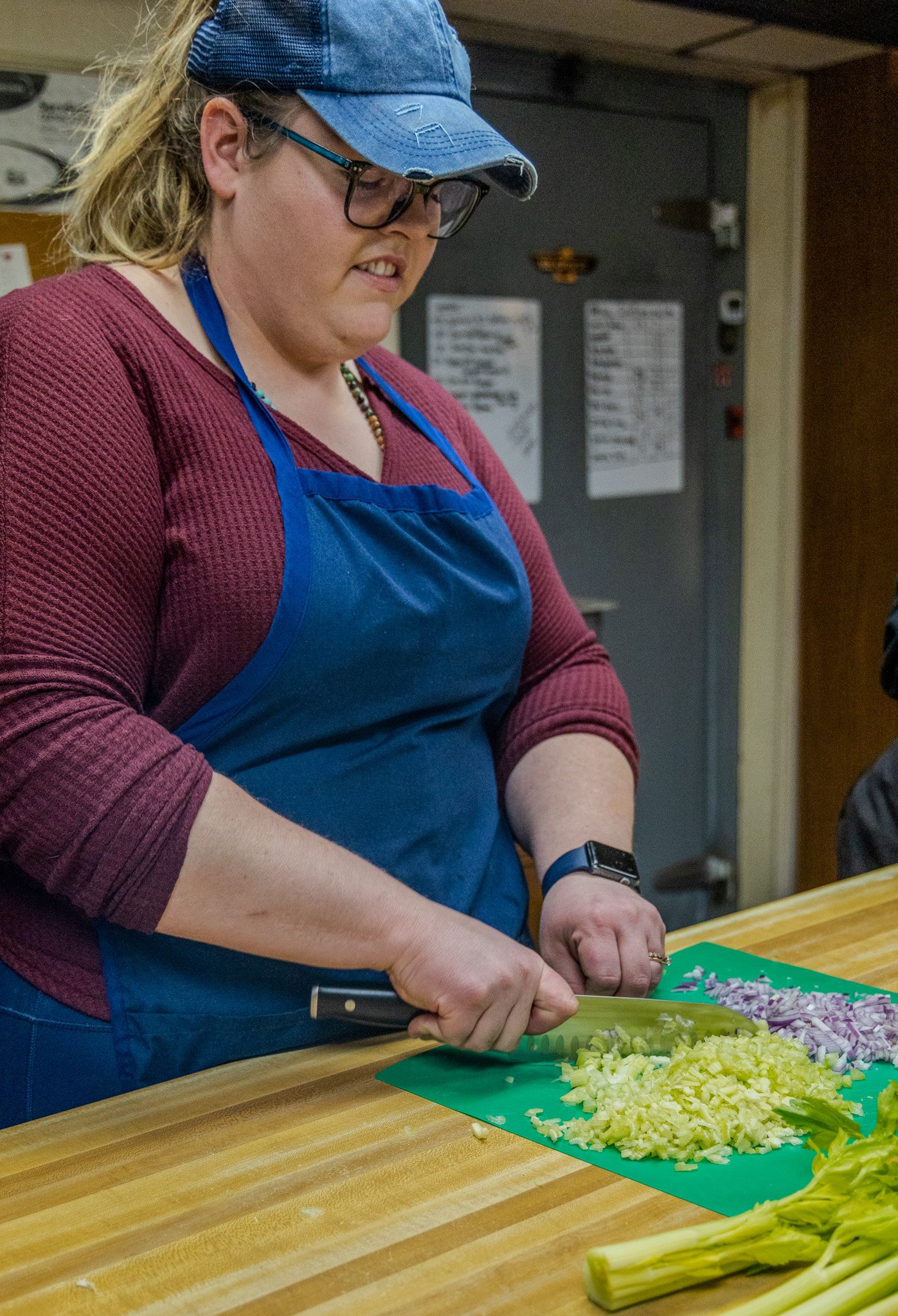 Niki of Boki's Kitchen preparing lettuce for catering