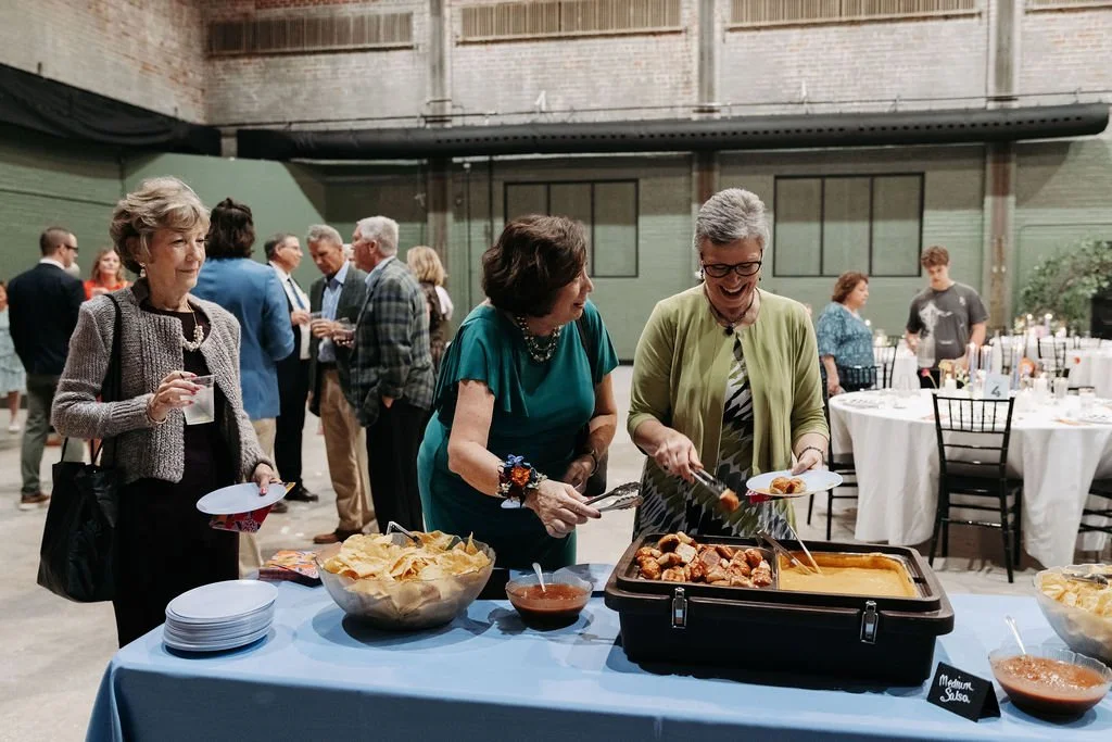 Guests enjoying their food at the wedding catering by Boki's Kitchen