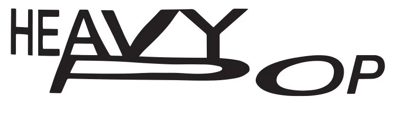 Logo with the word "HEAVY" and the words "OP" with stylized letters. The word "HEAVY" has a triangle instead of the letter "A" and a line under the "Y".