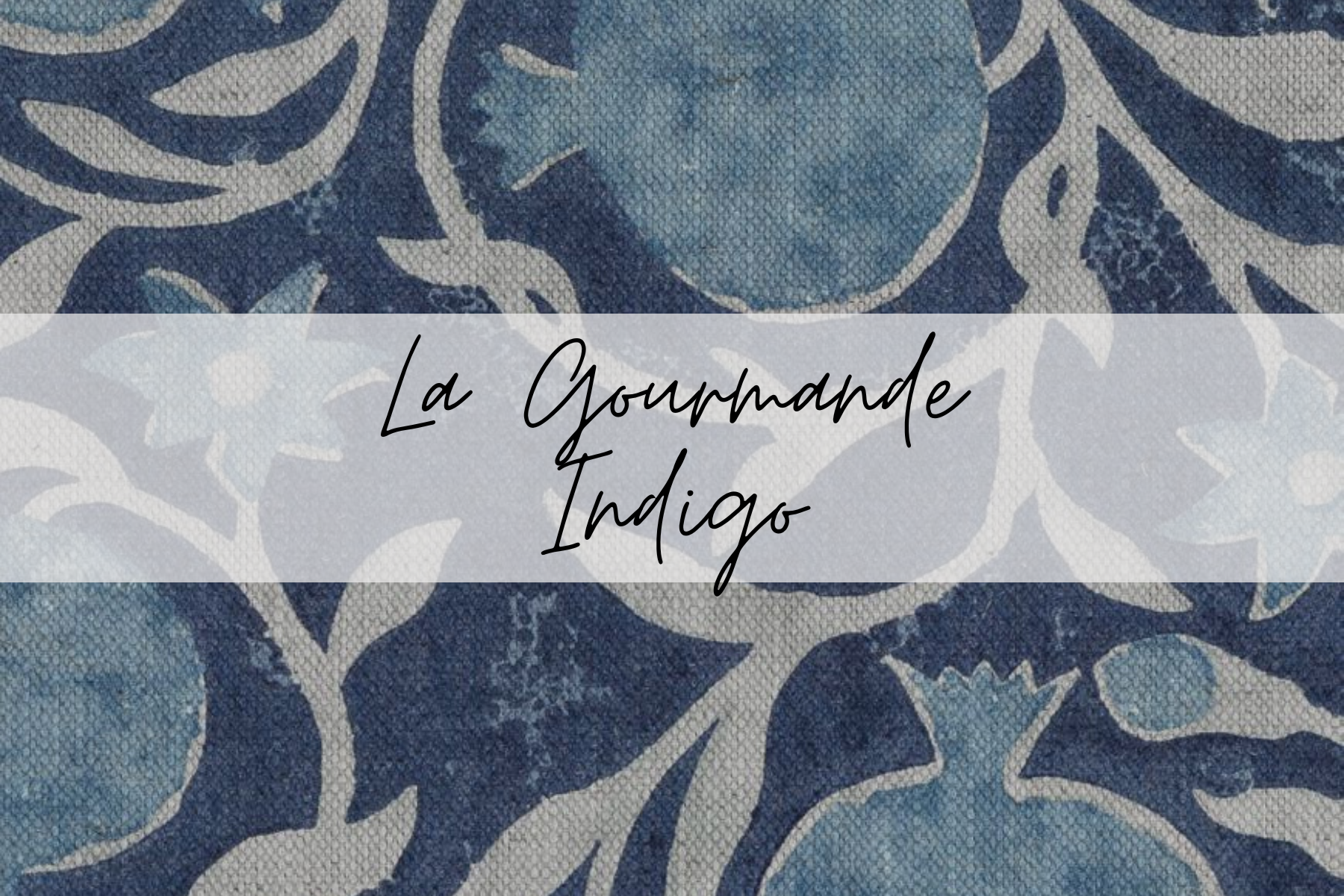 A tiled blue and white patterned surface with text overlay that reads 'La Gourmande Indigo' in black cursive font.