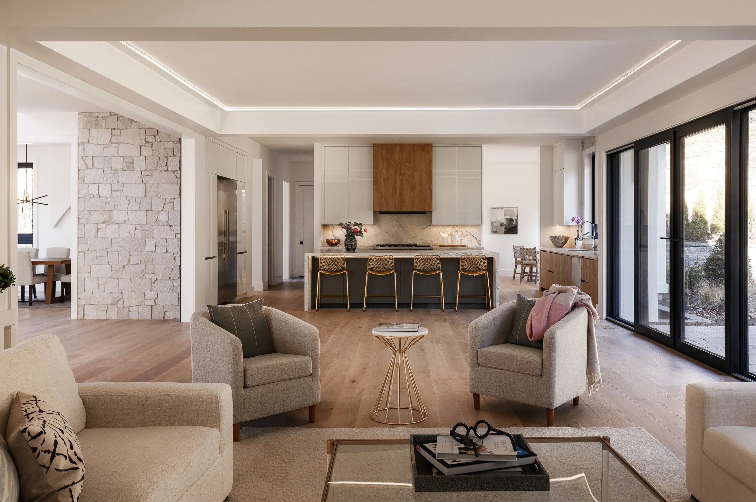 Open kitchen and living area designed by DFI Interiors in Needham Massachusetts