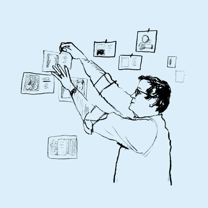A sketch of a person with glasses and dark hair, reaching up to hang or adjust pictures on a wall.