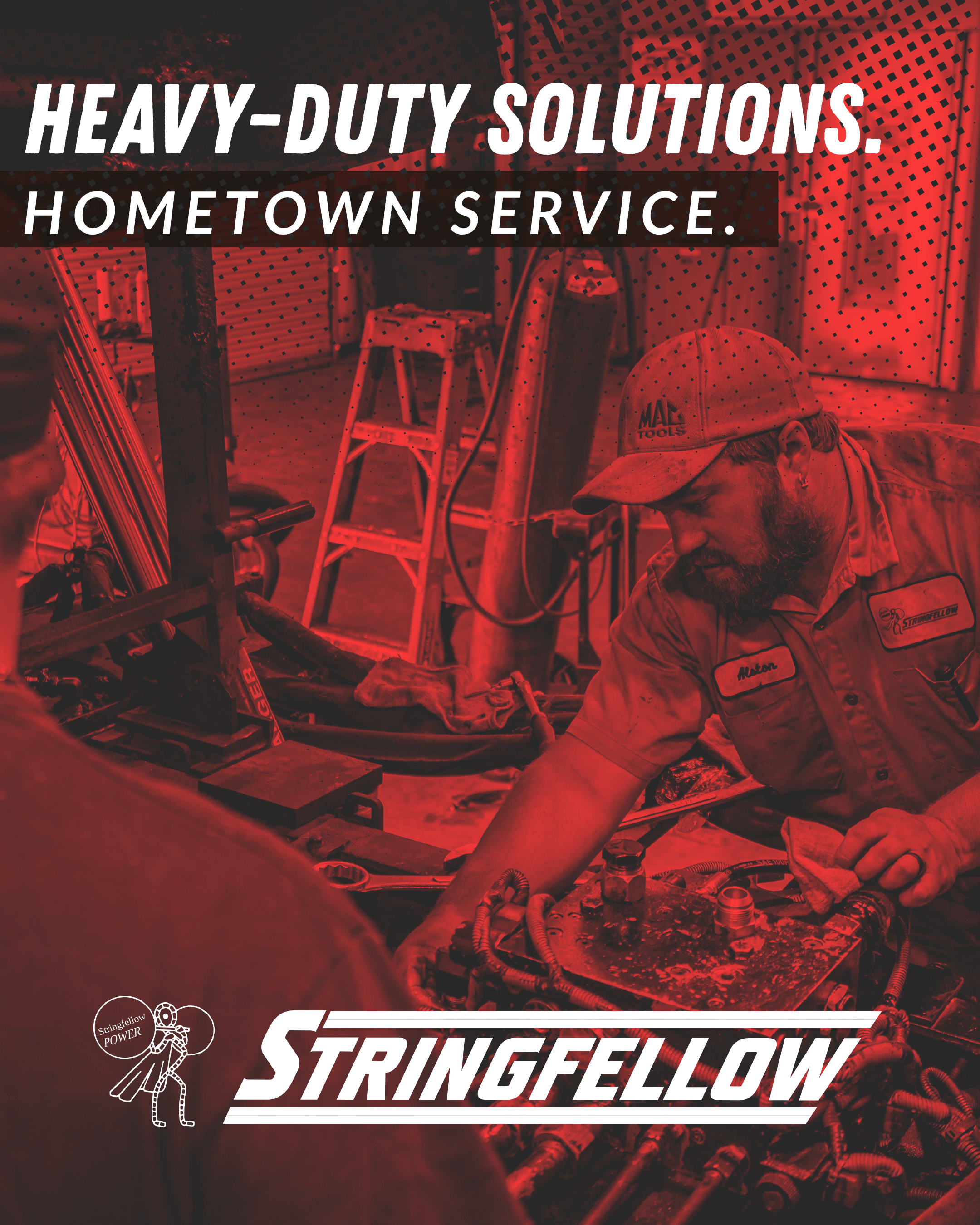 A man working on automotive or industrial equipment in a workshop, wearing a uniform and cap, with tools and machinery around him.