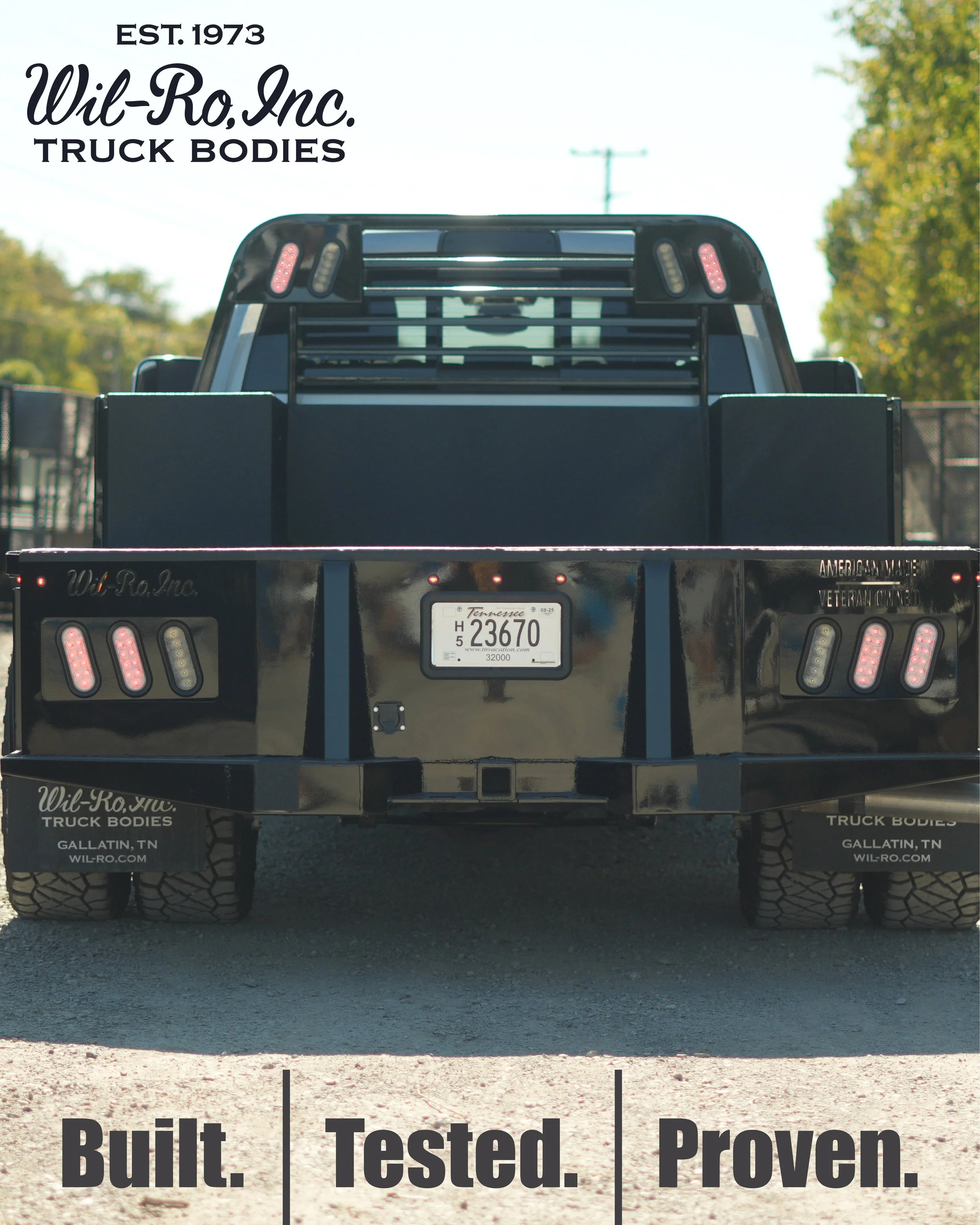 Rear view of a black truck with a Tennessee license plate, advertising Wil-Ro Inc. truck bodies, with the phrases "Built. Tested. Proven." at the bottom.