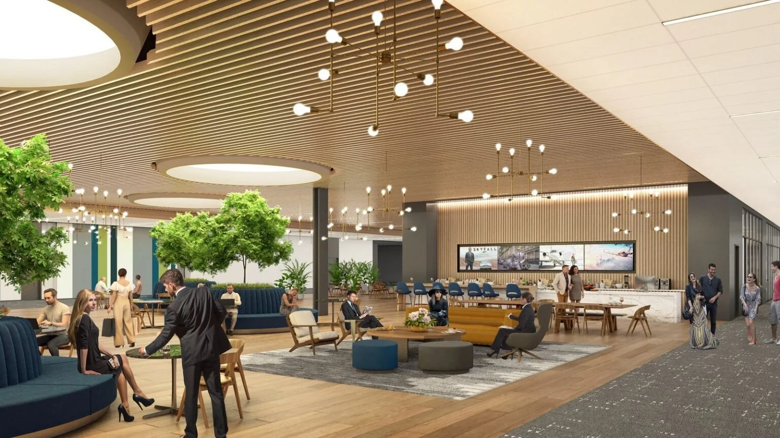 Modern hotel lobby with seating areas, large green trees, and decorative ceiling lights.
