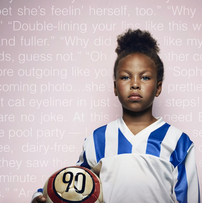 A young girl with curly hair and wearing a blue and white soccer uniform holding a soccer ball with the number 90 on it, standing in front of a pink background with white text.