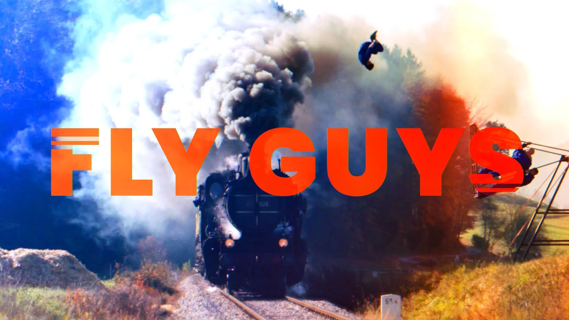 A steam locomotive pulling a train through a wooded area with smoke billowing from its chimney, overlaid with the text 'FLY GUYS' in bold red letters.