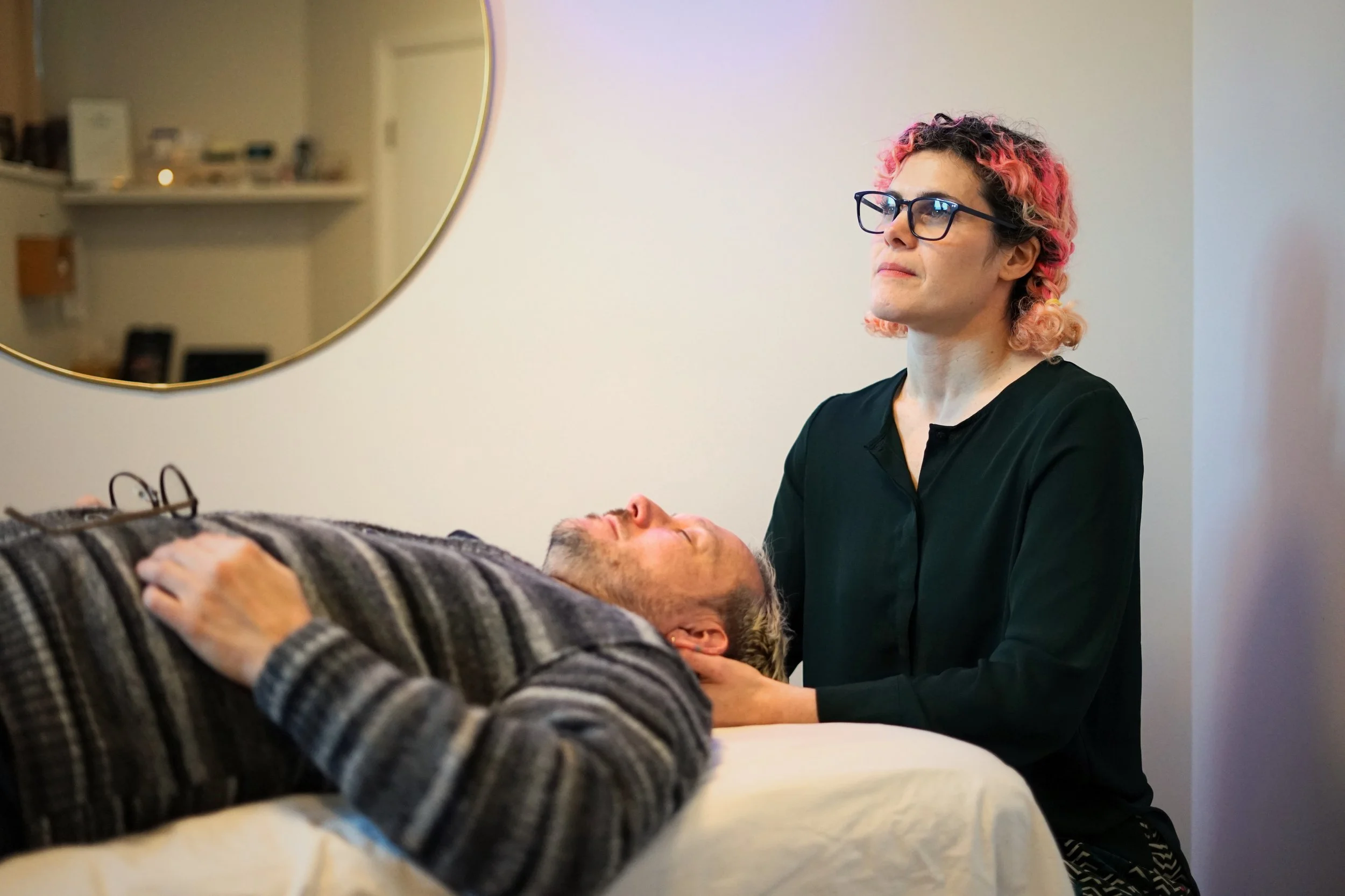 Dr Rodrigues performs gentle osteopathic manipulation on a male patient