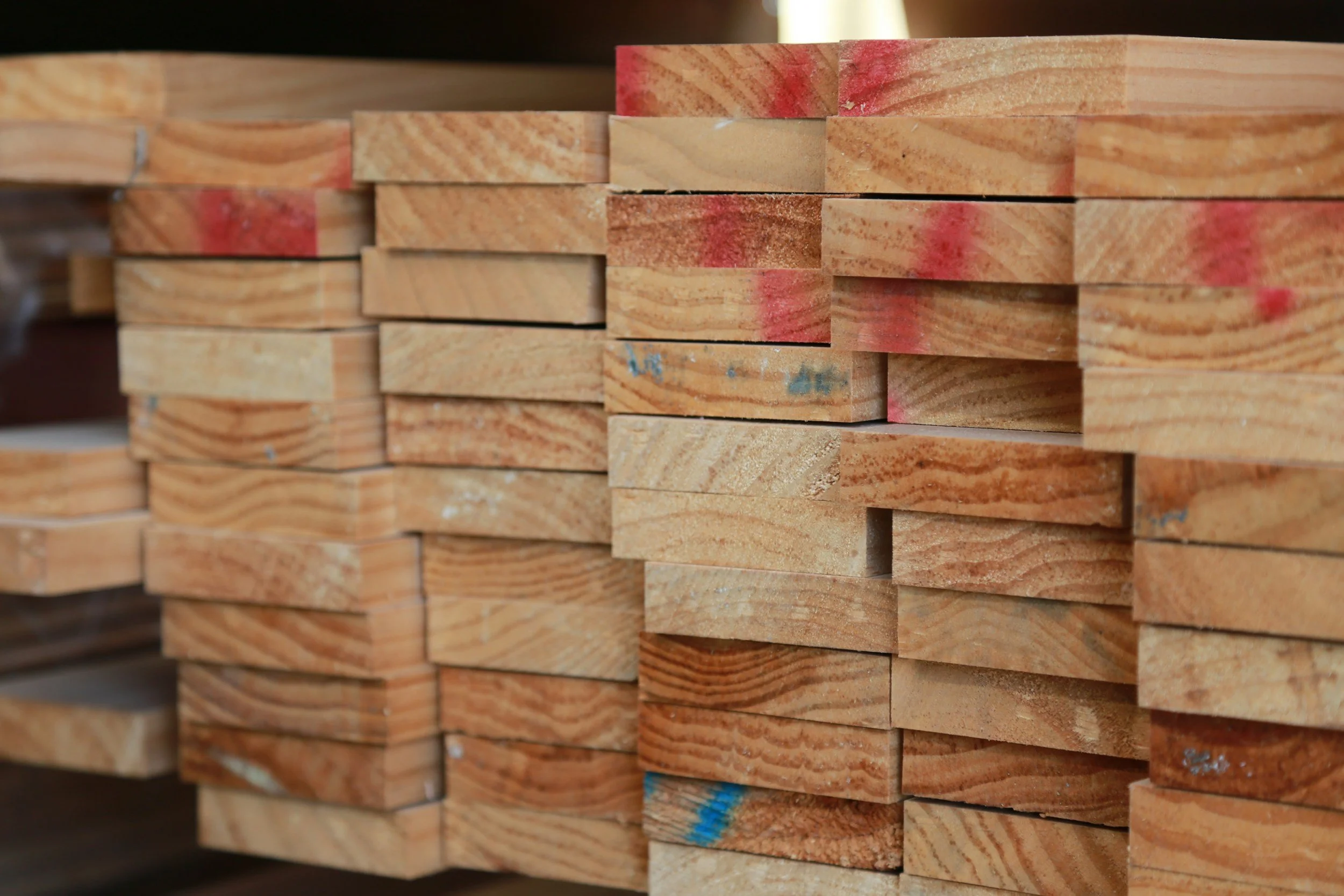 lumber stacked to be used for building a custom home