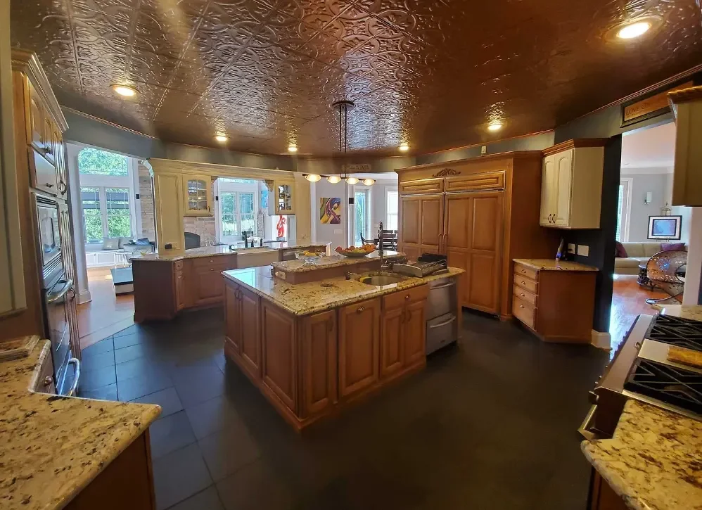custom kitchen with an island and a decorative ceiling