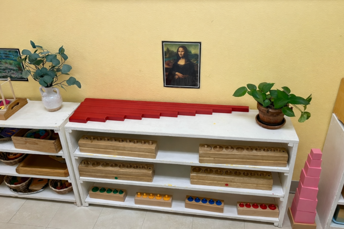 Montessori sensorial materials displayed on shelf in Austin Montessori preschool