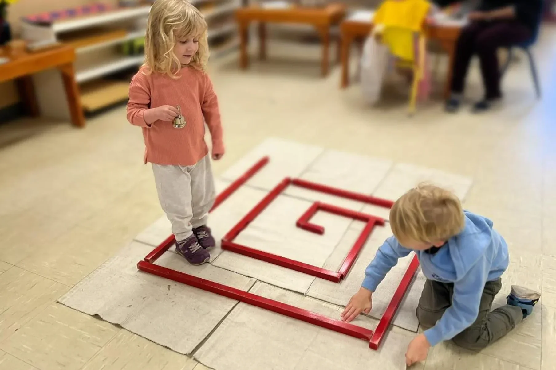 Children practicing careful control of movement in our South Austin Montessori