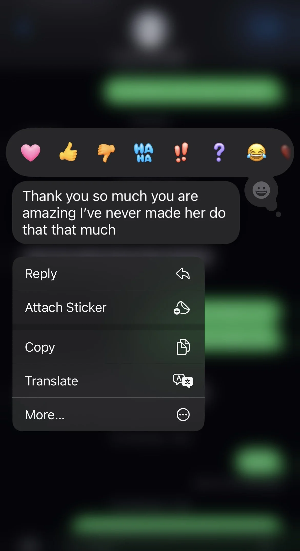 Screenshot of a messaging app showing a conversation with various emoji reactions and a message that reads, 'Thank you so much you are amazing I've never made her do that that much'. A menu with options like reply, attach sticker, copy, translate, an
