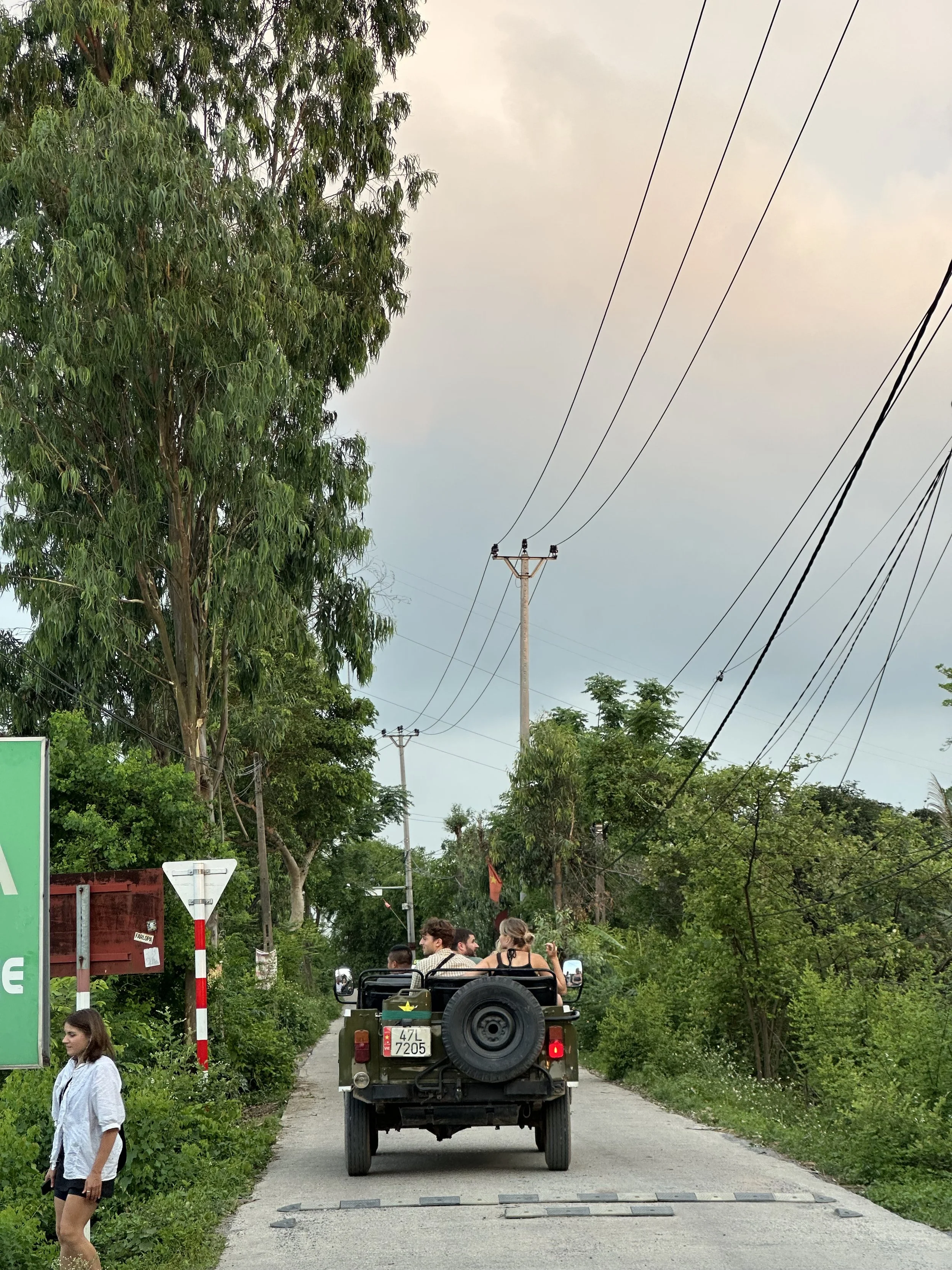 (Likely American) Tourists are taken around with a military truck. Feels odd to see it.
