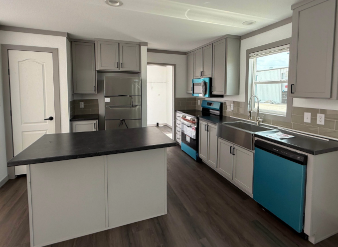 Marathon Homes - Pure White with Ozark Grey Cabinets, Basalt Slate Countertops, Architectural Gray Backsplash, and Rutledge Flooring.png