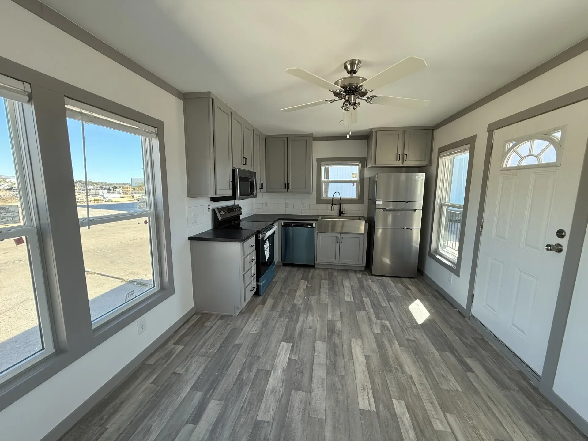 Tiny home kitchen with modern appliances and finishes