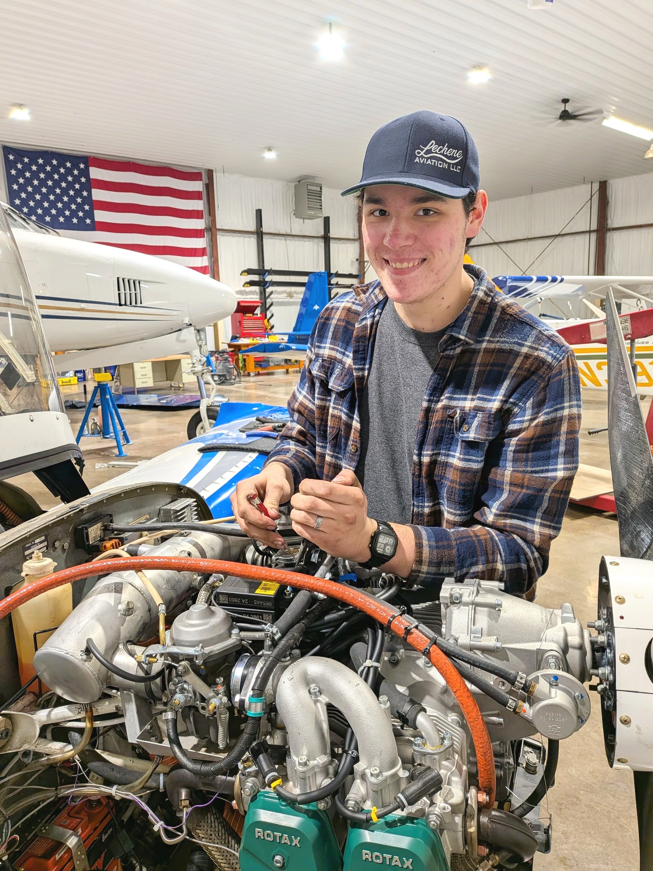 A&P Mechanic male fixing aircraft engine