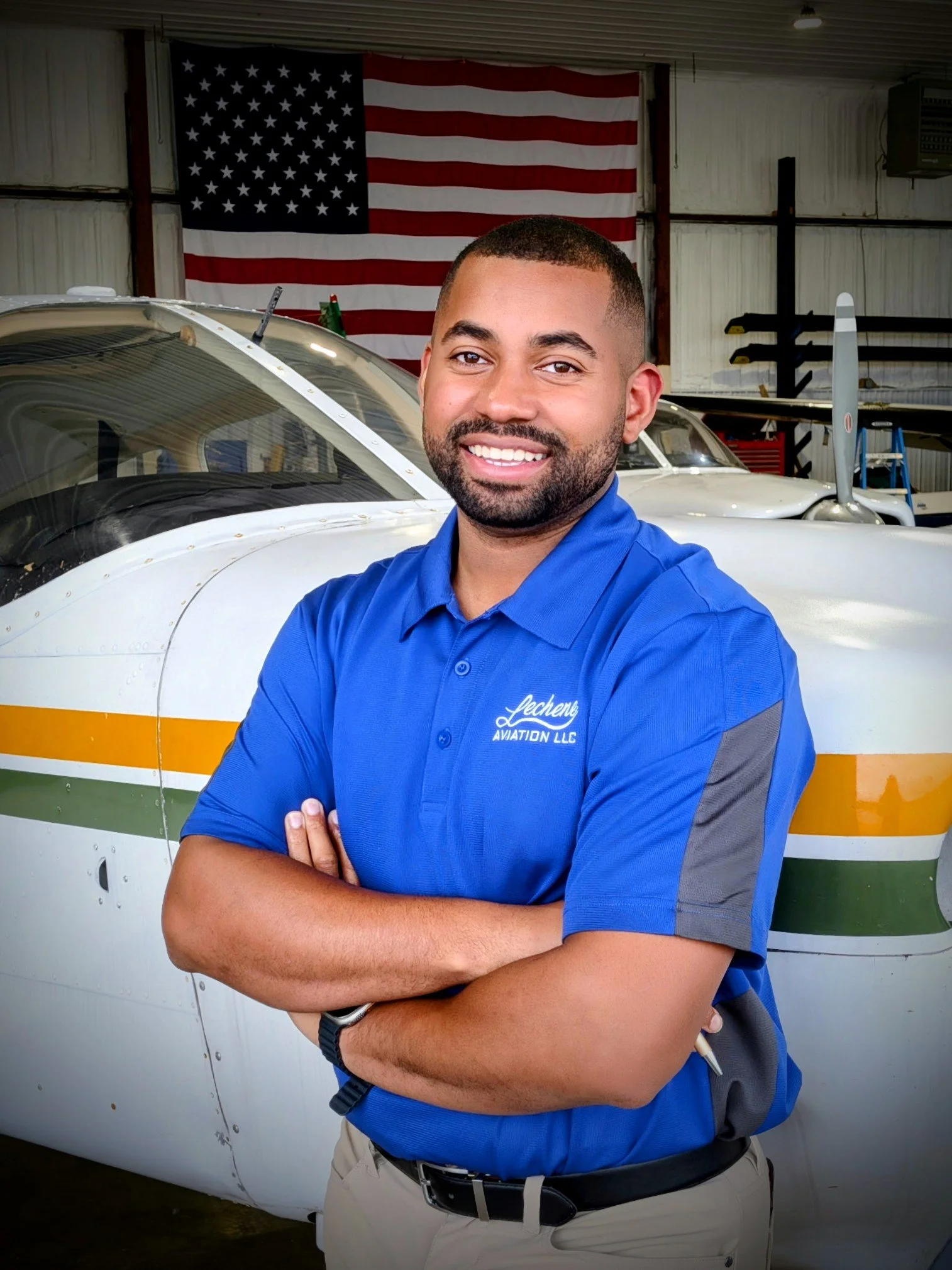 CFI leaning against aircraft