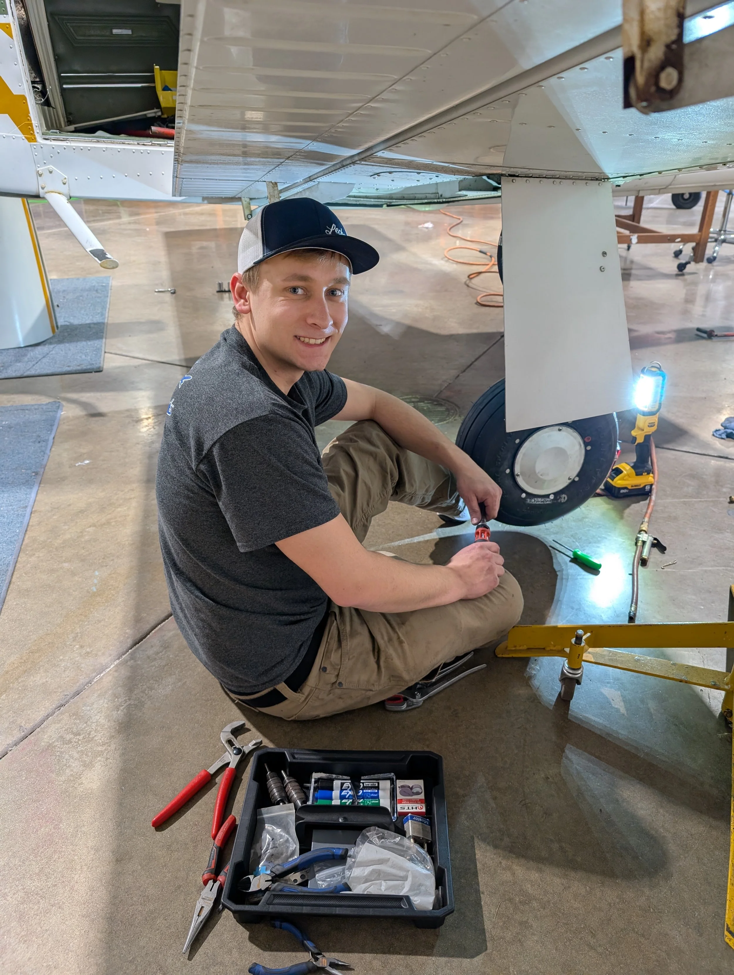 A&P Mechanic male fixing aircraft tire