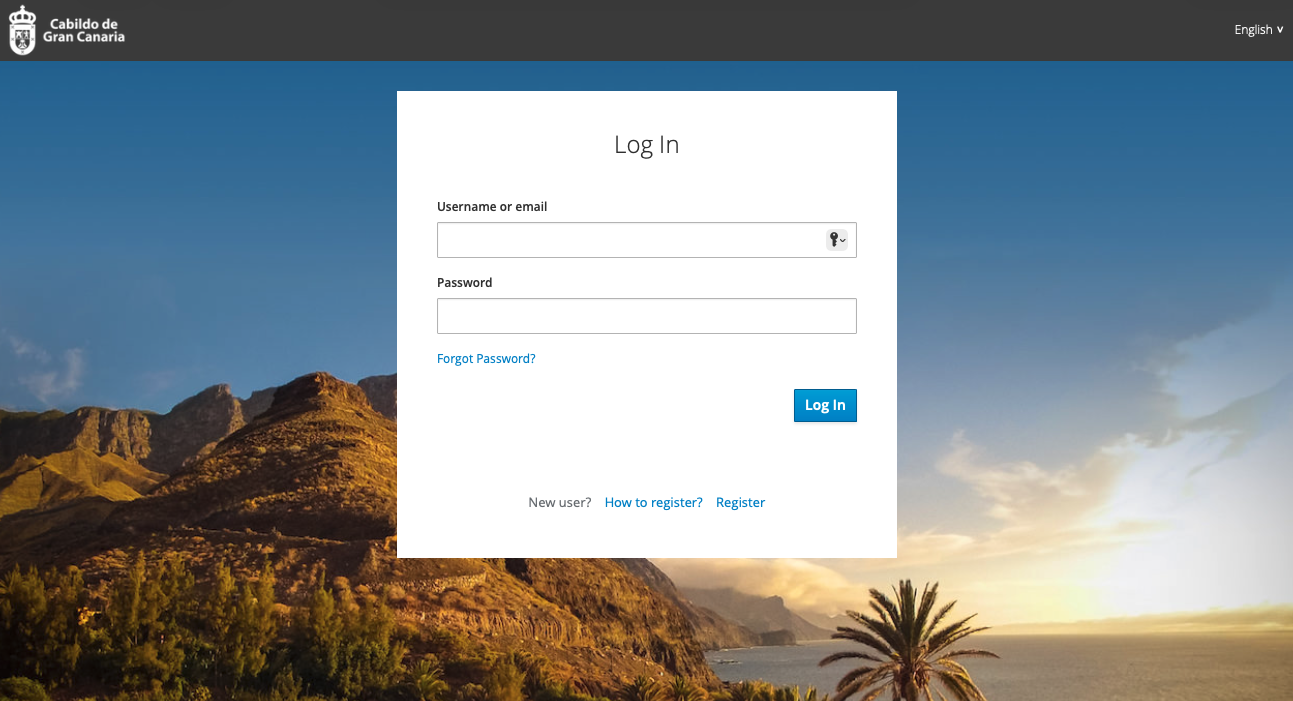 Login page for Cabildo de Gran Canaria featuring a background image of mountainous landscape with greenery, a palm tree, and a sunset over the ocean.