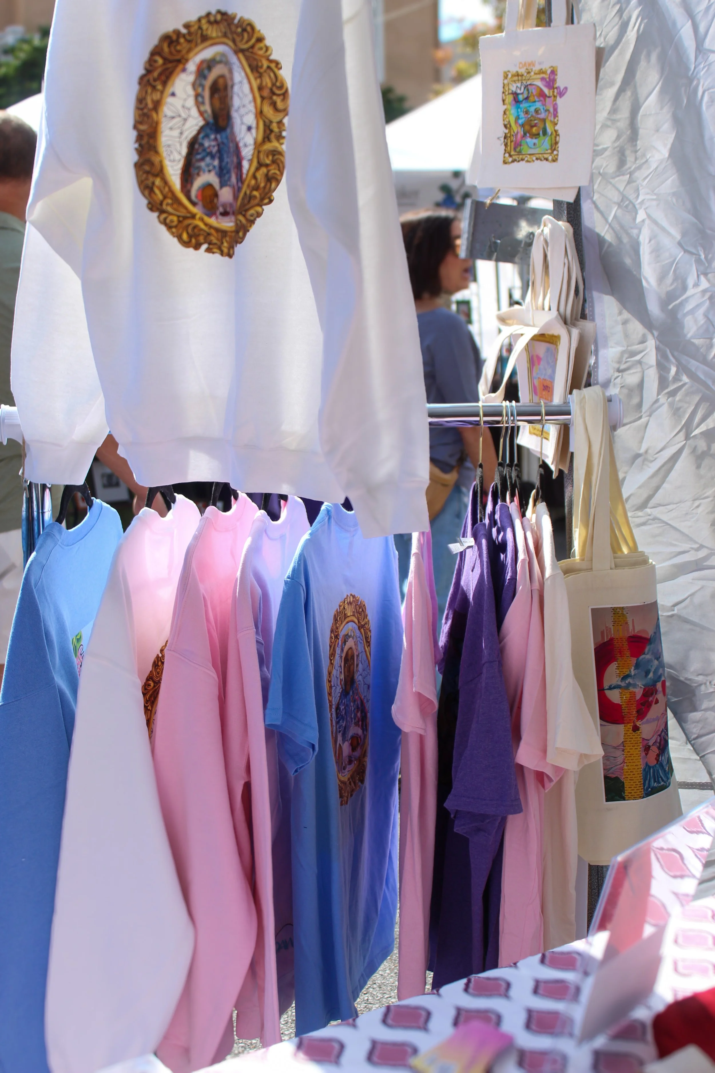 Booth Festival setup.  Sweatshirt of  "Flowers," original art work by Dawn White.