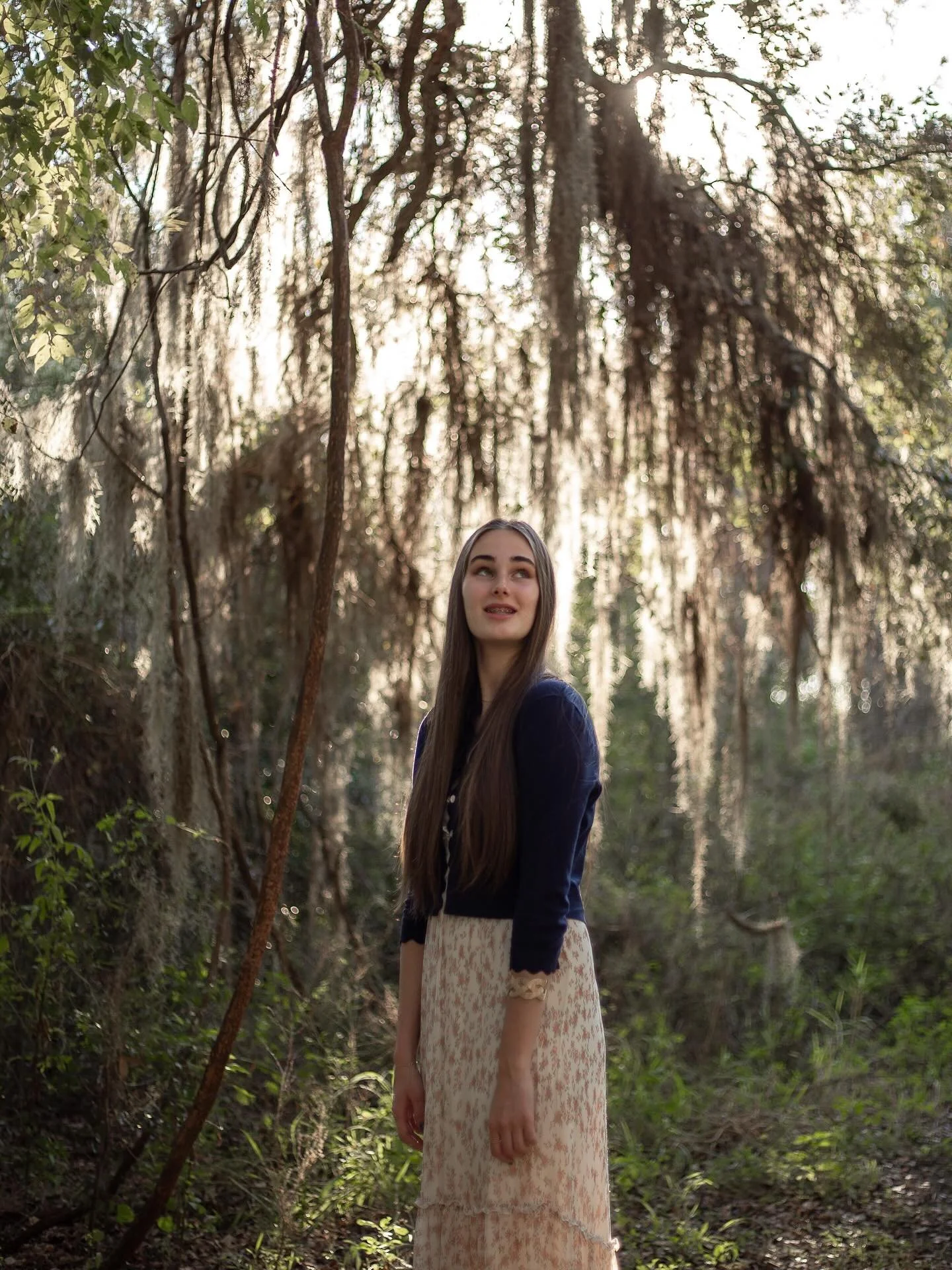 Among the trees, she looked like a character from a fairytale &mdash; calm, gentle, and full of light.
There&rsquo;s something beautiful about portraits taken in nature&hellip; they always whisper their own story. 🍃

With love &amp; light,
Tatiana |