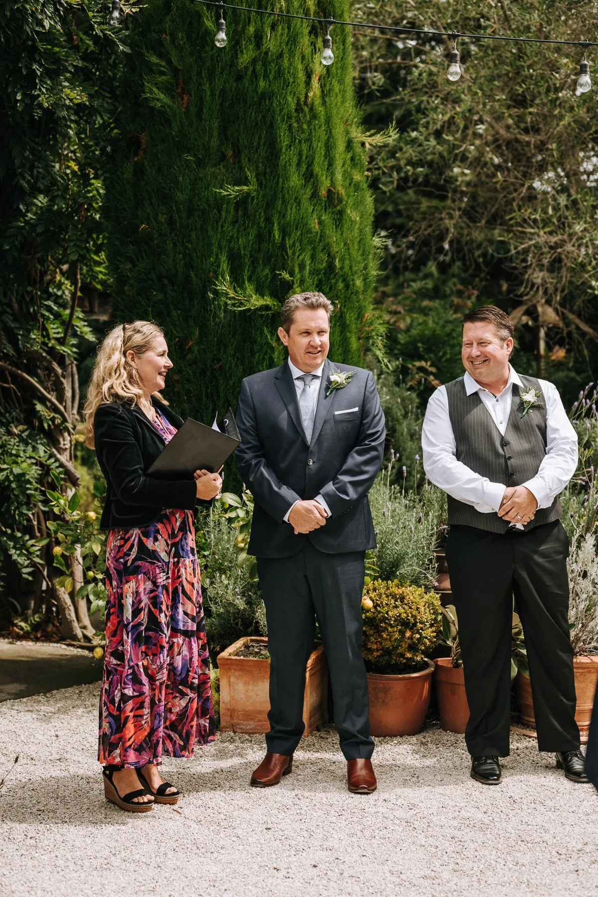 Laurie’s customers, Fernando and Kate embracing by the lake on their wedding day.