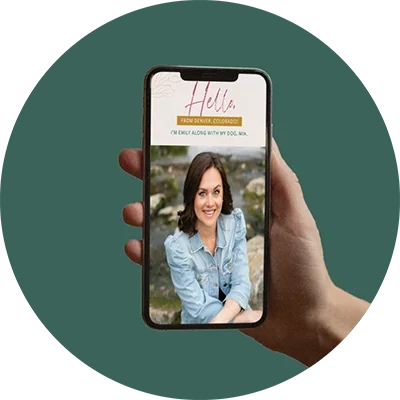 A person holding a smartphone displaying a woman's profile with a smiling portrait outdoors, with the greeting "Hello" and information about her from Denver, Colorado.