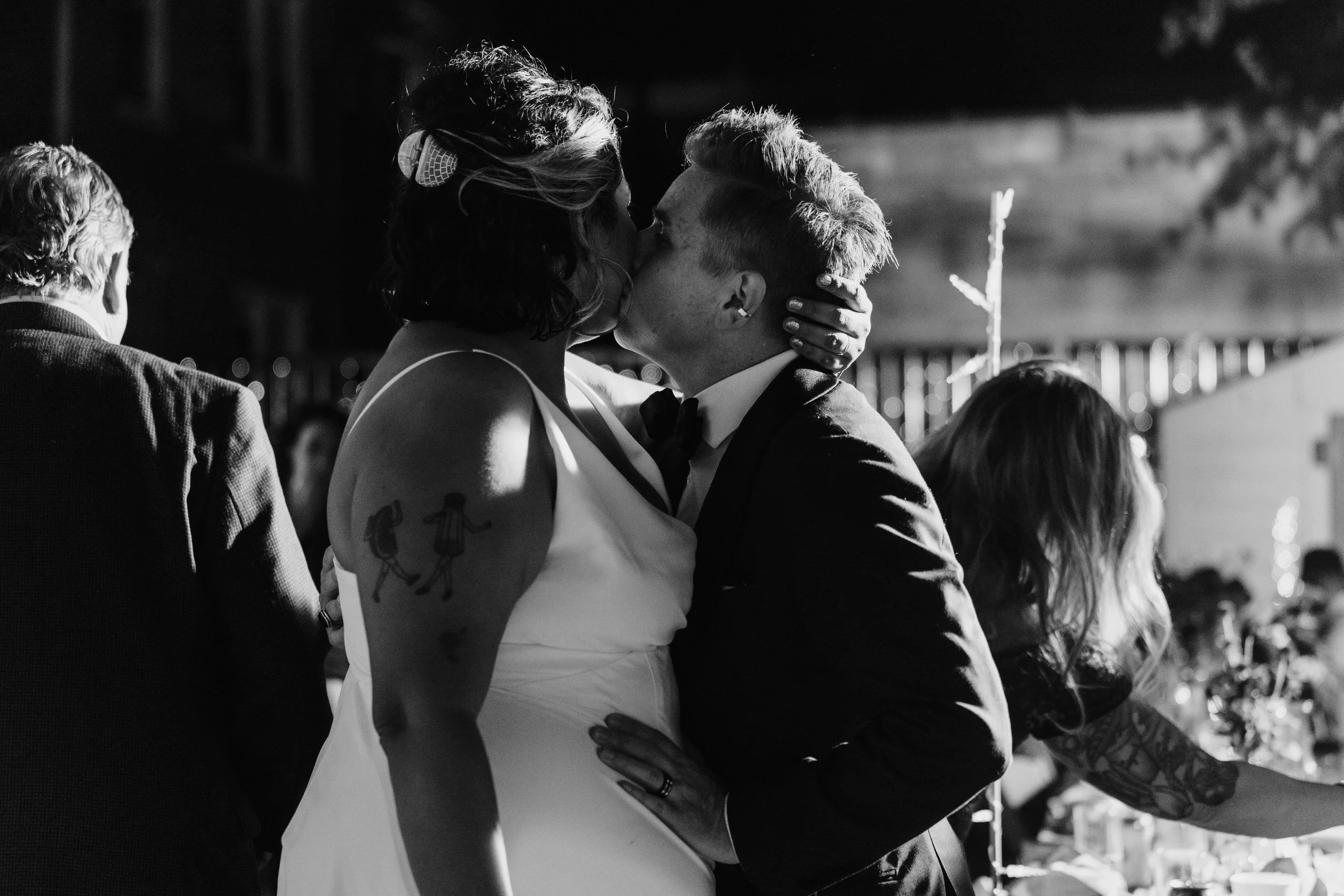 a newlywed couple kissing