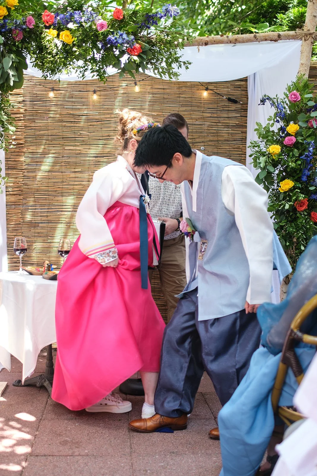 A newlywed couple stomping on the ground together