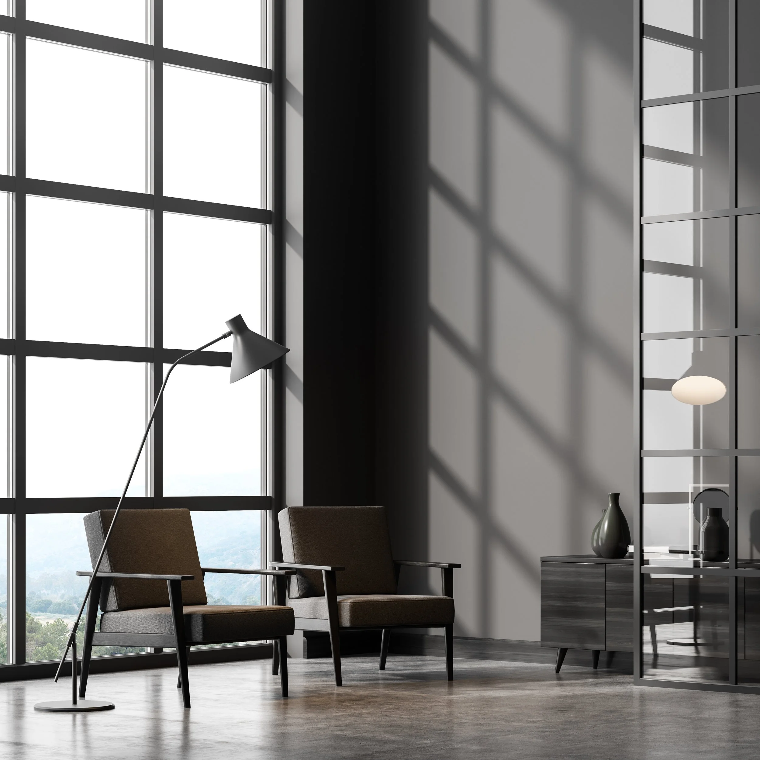 Modern living room with large windows, two brown armchairs, a black floor lamp, and a black sideboard with decorative vases, featuring shadows cast by window grid on the wall.